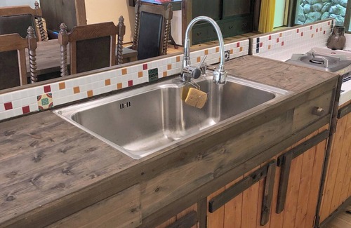 Matsusaka House | An old house with a spacious kitchen surrounded by mountains and clear streams