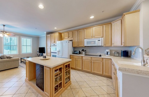 Sunset Island House | Bay view townhome with multiple decks, pool & gym - walk to the beach