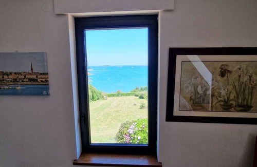 Lanmodez House | Beach view villa at the end of the garden covered swimming pool heated all year round