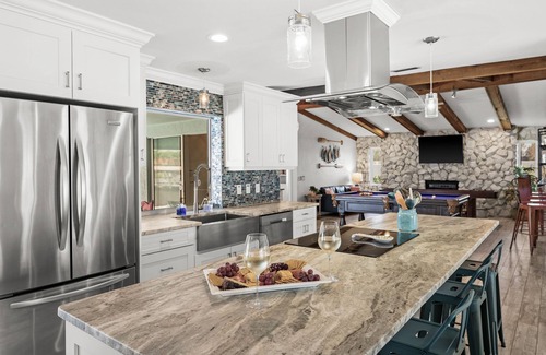 Caloosahatchee House | Beautiful Dog Friendly Home with Screened-in Heated Pool, Game Room/Bar