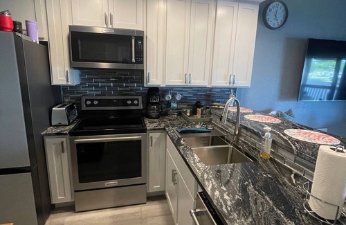 Thomas Drive Condo | Beautiful Lagoon-View Condo – 1BR + Loft in Gated Community, 5-Min Walk to Beach
