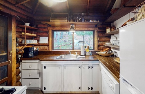 Boothbay Harbor Cabin | Beautiful, rustic cabin overlooking Lewis Cove with porch, deck & fireplace