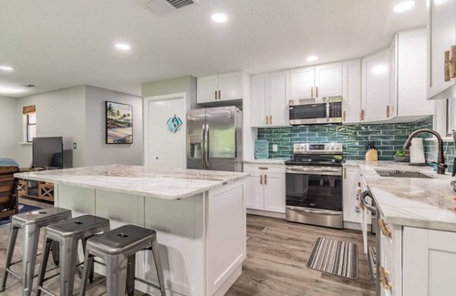 Weeki Wachee Gardens House | Beautiful Weeki Wachee river house with kayaks, slide, and river views