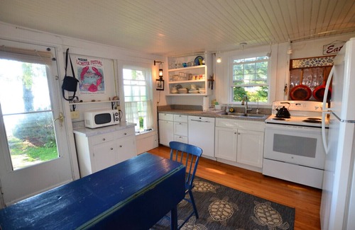 Spruce Head Cottage | Berry Cottage, private dock, overlooking a sandy beach and bustling harbor