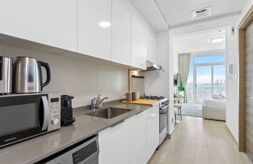 Jumeirah Village Circle Apartment | Bloom Towers Gem: Elegant Studio -A Must-See!