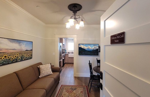 Historic Railroad District House | BookStayHop -RedTail Orliena Suite, Relaxing Hot tub and a Tesla Station