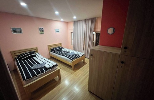 Vake Hotel | Budget twin room with shared bathroom in Galaxy Hostel