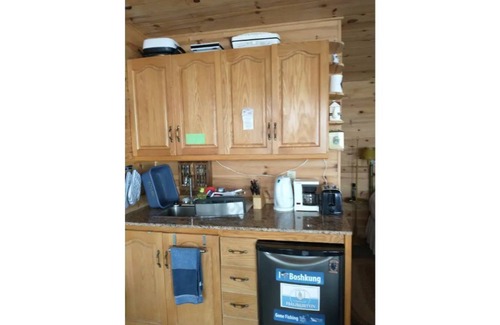 Algonquin Highlands Apartment | Charming waterfront mini-cottage on peninsula, footsteps to water's edge