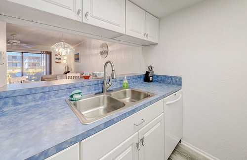 Harbor Oaks Condo | Canal-front condo with deck, balcony, grill, pool, dock, & tennis - near beach