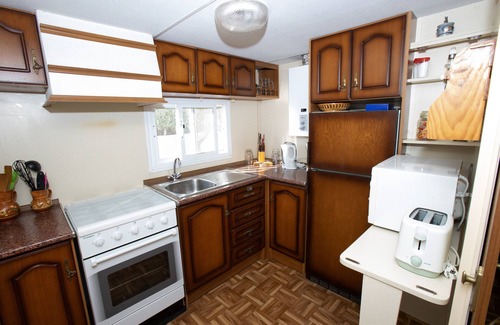 Mutxamel RV Rental | Caravan 'Mobilhome Mit Garten Und Pool' with Shared Pool, Wi-Fi and Air Conditioning