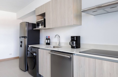 Barrio Santa Lucia Apartment | Casago Brand New Stunning Ocean View Condo for the Ultimate Coastal Escape