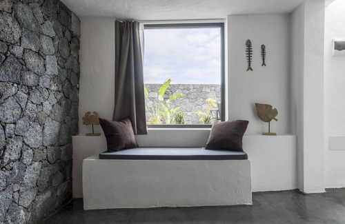 Tinajo House | Cave Room (ex-tank) with volcanic rock