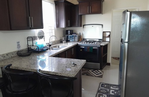 Old Harbour House | Charming 2-bedroom house in Old Harbour with AC, fitness room. C & J"s Vacation