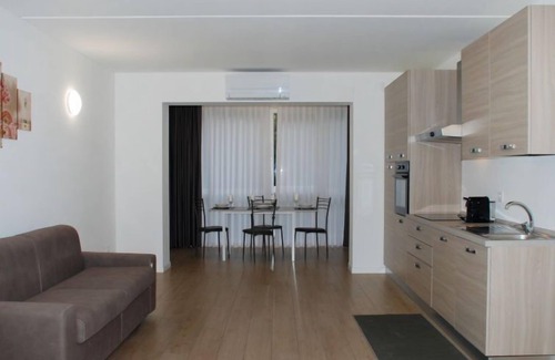 Bissone Apartment | Charming Gardenview App. 102 by Interhome