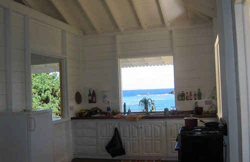 Friendship House | Charming seaside villa with wraparound veranda, ocean views and wind.