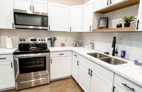 Spring Apartment | Charming Urban Retreat: Where City Life Meets Farmhouse Serenity.