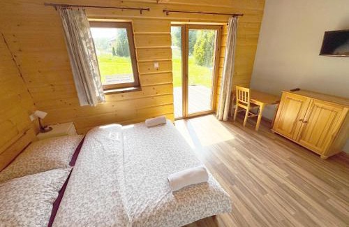 Ustrzyki Dolne Cabin | Chata Wilka - całoroczny dom z bali na wyłączność z 3 sypialniami