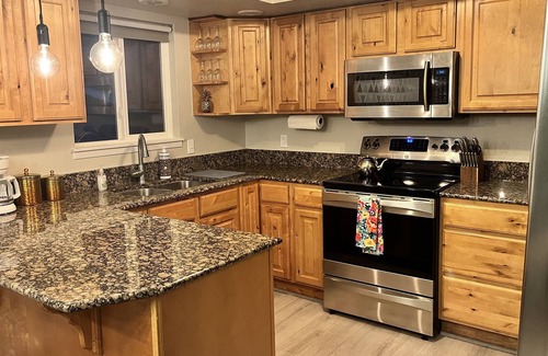 West Bench House | Cheerful home! Hot tub, fire pit, covered patio