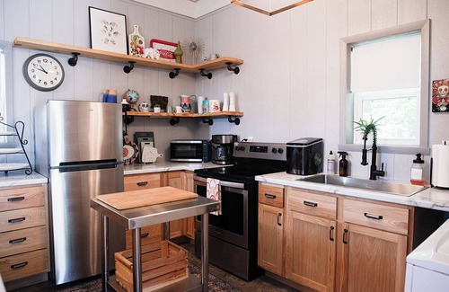 Kerr House | Clean and cozy barn home nestled in the trees with peaceful outdoor spaces!