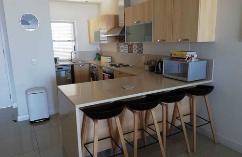 Plettenberg Bay Apartment | Cosmo Chic Holiday Rental walking distance to beaches, shops & restaurants