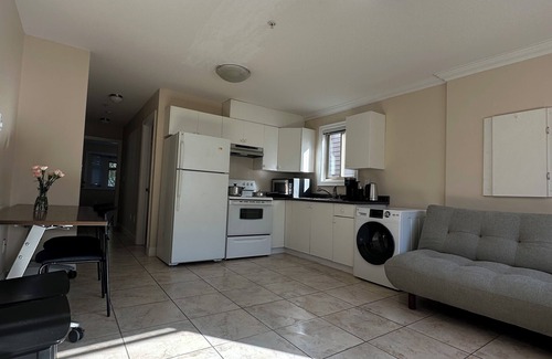 Marpole House | Cozy 2BR in West Side Kitchen & Living