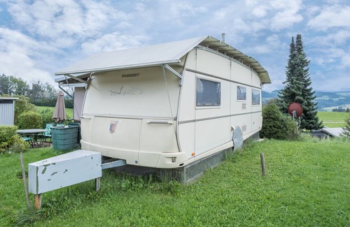 Weiler-Simmerberg RV Rental | Cozy Caravan “Camping Stellplatz Nr. 43” with Mountain View, Garden Area & WiFi; Parking Available
