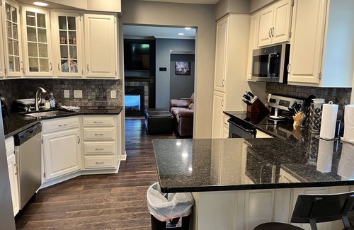 Oshkosh House | EAA rental near airport w/firepit, backyard, peekaboo lake view, and a clear sky