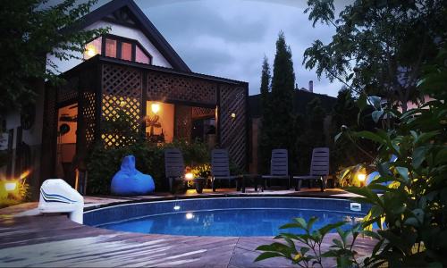 Lesniki House | Eco-House PERI with a pool and in the garden near Kyiv