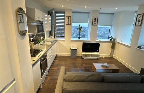 Collier's Wood Apartment | Elegant 2-bedroom retreat in London, complete with complimentary Wi-Fi.