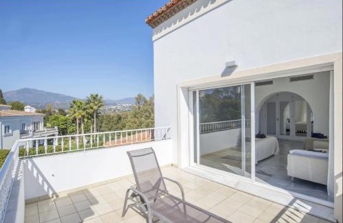 Puerto Banus Villa | Elegant Villa Retreat with Lush Gardens by Lodgerstrip