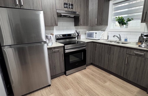 East Clayton House | Experience luxury and security in our new 2 bedroom 1 bath suite with kitchen.