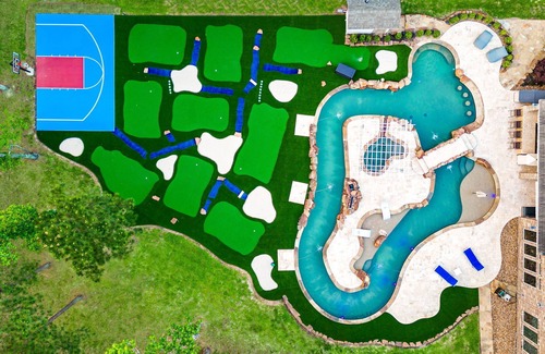 Spring House | Extended-stay paradise: lazy river, theater, poker, Peloton, mini golf and more.
