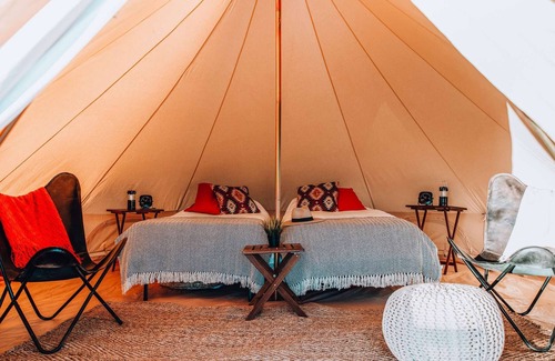 Island Park House | Family Tent w/Shared Bathroom - Step into our open field between the mountains.