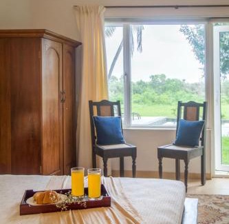 Nerul Apartment | Frangipani 4BR with Pool & Field View