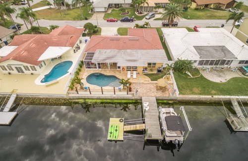Gulf Harbors House | Free use of pontoon boat for your stay. Paradise on the water with heated pool