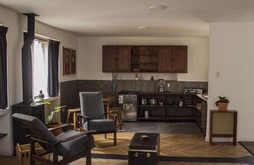 Downtown La Paz Apartment | Garden and fireplace, bedroom suite