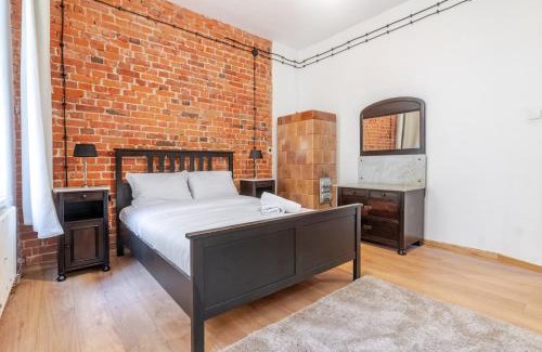 Gliwice Apartment | Gliwice Industrial Brick Style Apartment by BookingHost