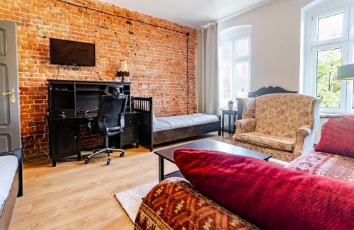 Gliwice Apartment | Gliwice Industrial Brick Style Apartment by BookingHost