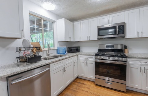 Stone Mountain House | Gorgeous 4-Bed Home Sleeps 20, Near Airport & Downtown!