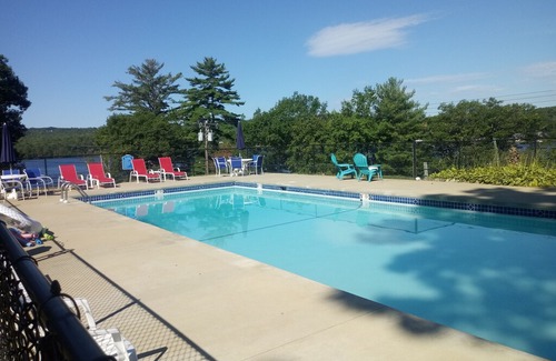 Laconia Resort | Great location with lake views ,pool and private beach.