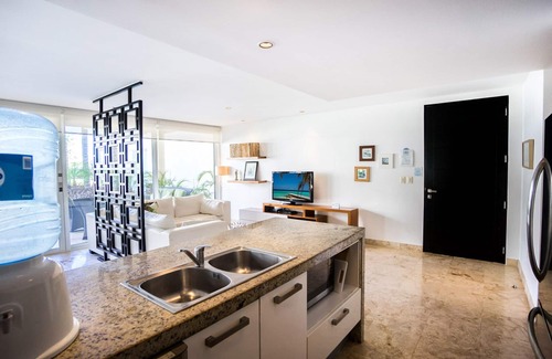 Puerto Juarez Condo | Ground floor right off the huge Infinity Pool at The Elements by BRIC