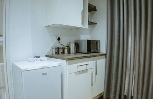 Harare Apartment | Harare Deluxe Homes- Grey-SuitenSelf contained studio with workspace and wifi