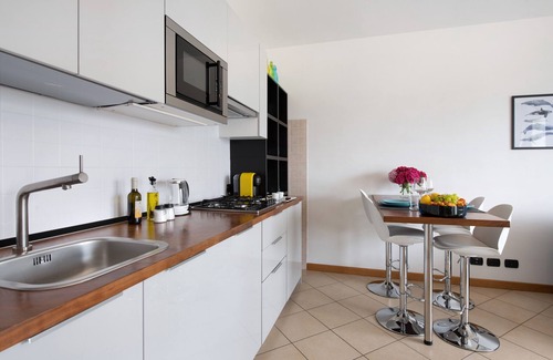 Predore Apartment | Holiday Apartment "Residence Perlago Fiordaliso" with Lake View, Shared Terrace & Wi-Fi