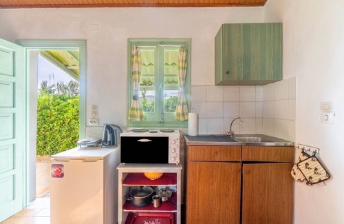 Ag. Georgios House | Holiday Home 'Seafront Studio Stefan' with Sea View, Private Terrace and Air Conditioning