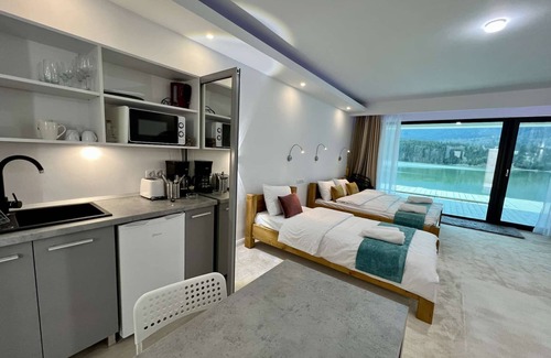 Colibita Apartment | Incredible room with lake view at Lake Colibita, next to the lake.