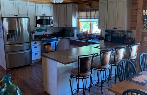 East Chop House | Indulge in the ultimate vacation experience at this exquisite custom log home.