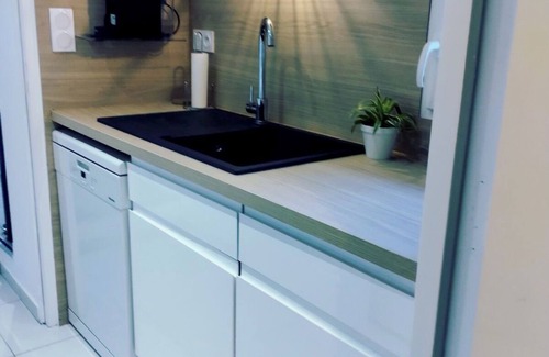 Jullouville Apartment | Jullouville - Full center - 50m from the sea - apartment - small garden