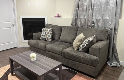 Saskatoon Apartment | Kick back & relax in this calm, stylish space.