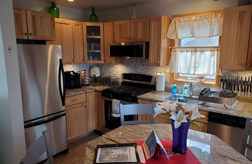 Franklin House | Lakefront Home Near Acadia National Park: Dock kayaks paddle boards & swim raft