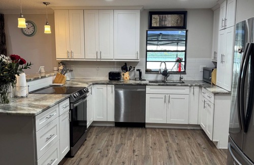 Eustis House | Lakefront Paradise Sauna Hot Tub Jet Skis Sunset Views